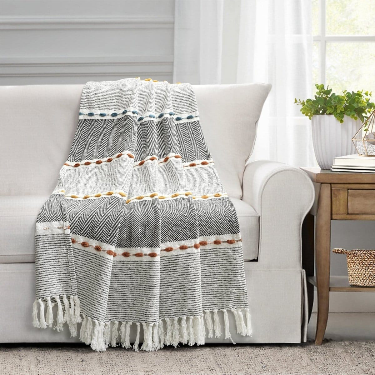 Herringbone striped cotton throw with tassels