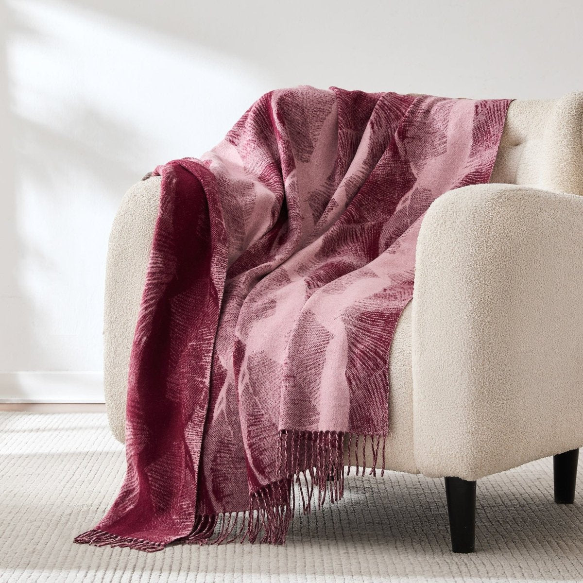Wool and cashmere throw with a forest-floor inspired pattern
