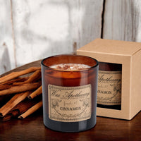 Cinnamon botanical candle in an amber glass tumbler