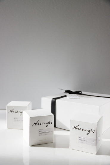 Gift set of three mini candles with a wick trimmer and scent cards