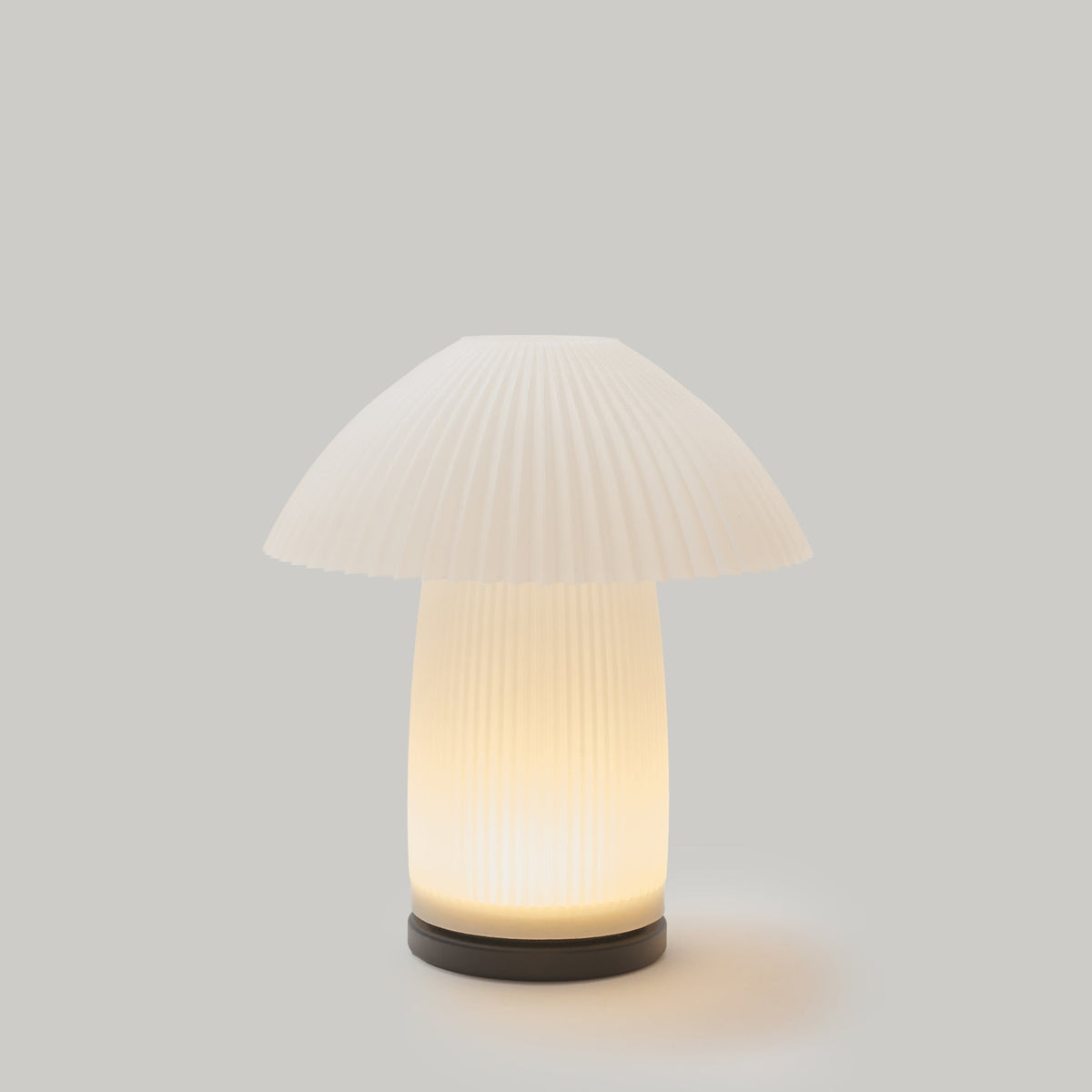 Cordless mushroom-shaped lamp with a pleated shade