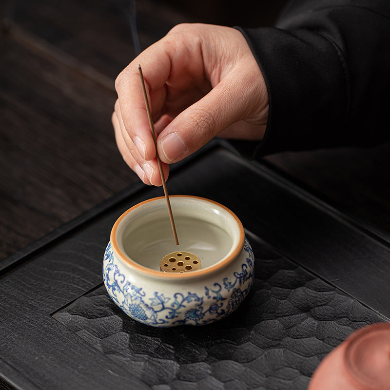 Lotus incense burner with blue-and-white vine pattern