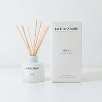 Sprig reed diffuser in a matte white glass vessel