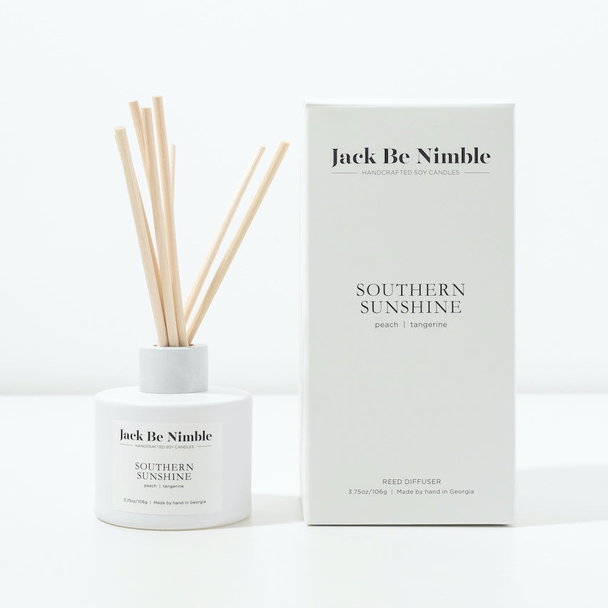 Southern Sunshine reed diffuser in a matte white glass vessel
