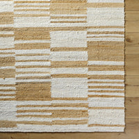 Natural jute flatweave rug in ivory and tan stripe pattern.