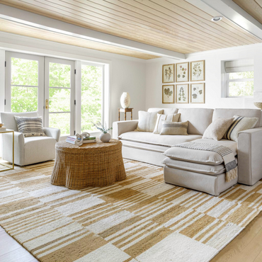 Natural jute flatweave rug in ivory and tan stripe pattern.