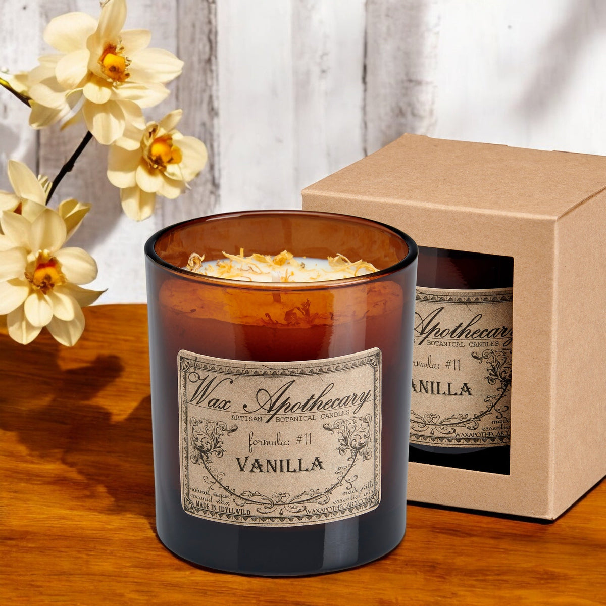 Vanilla botanical candle in an amber glass tumbler