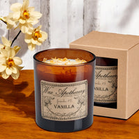 Vanilla botanical candle in an amber glass tumbler