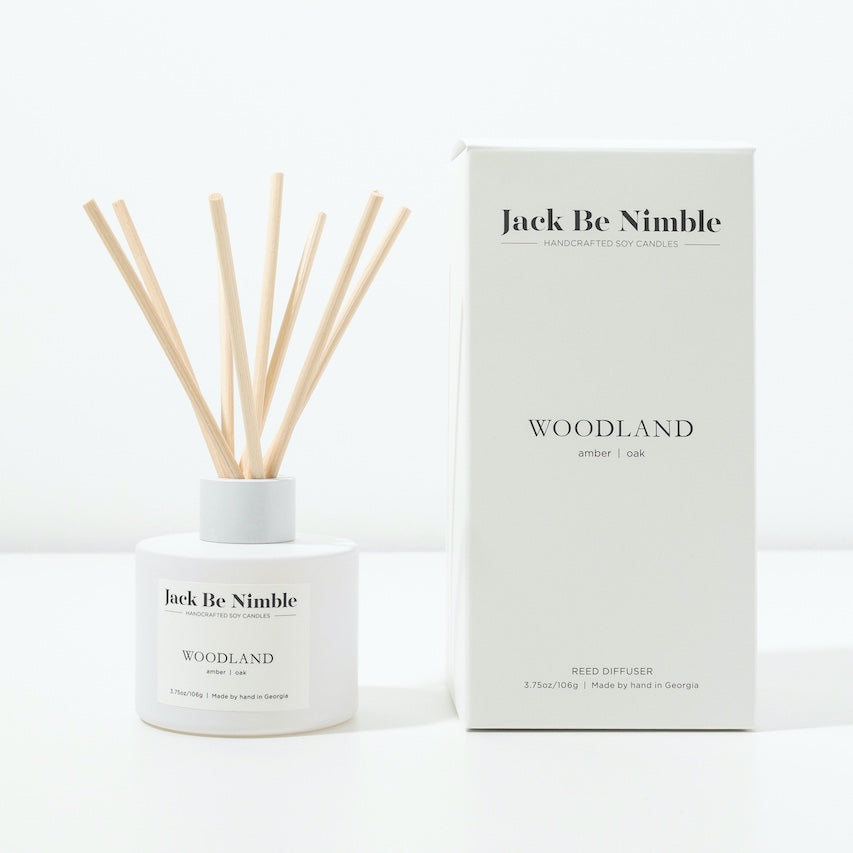 Woodland reed diffuser in a matte white glass vessel