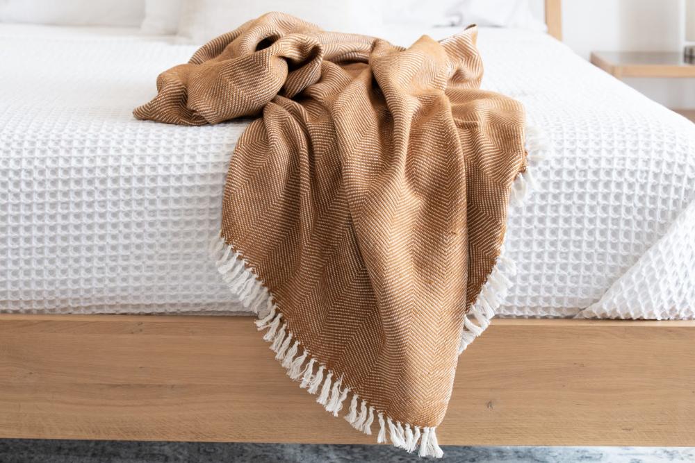 Thick handwoven Ethiopian cotton throw with a herringbone pattern and tied fringe