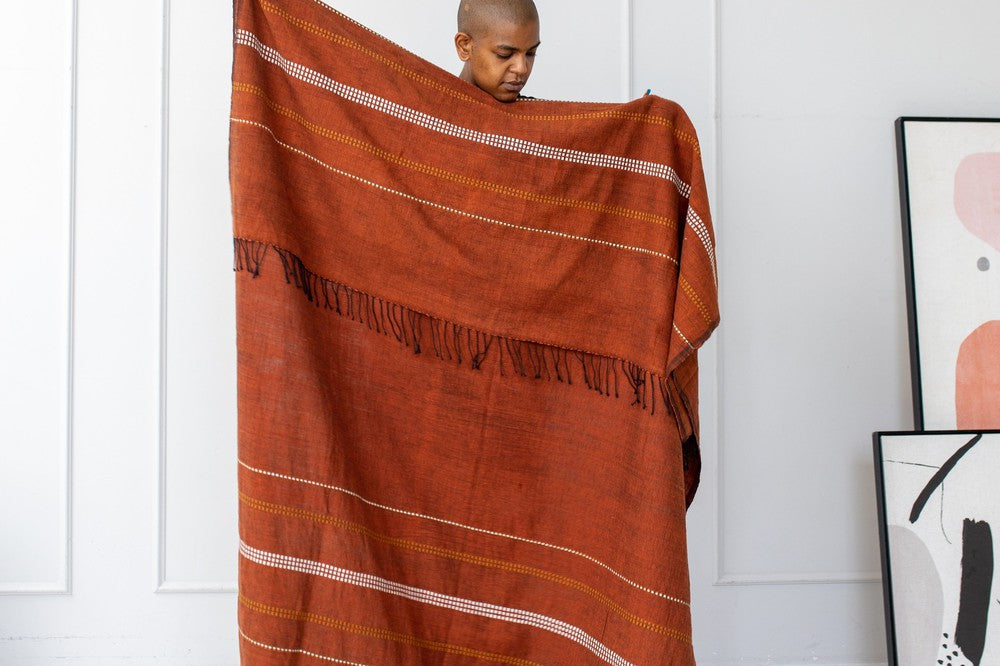 Handwoven Ethiopian cotton throw blanket with a traditional motif and twisted fringe