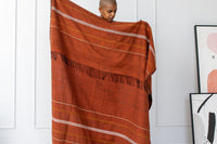 Handwoven Ethiopian cotton throw blanket with a traditional motif and twisted fringe